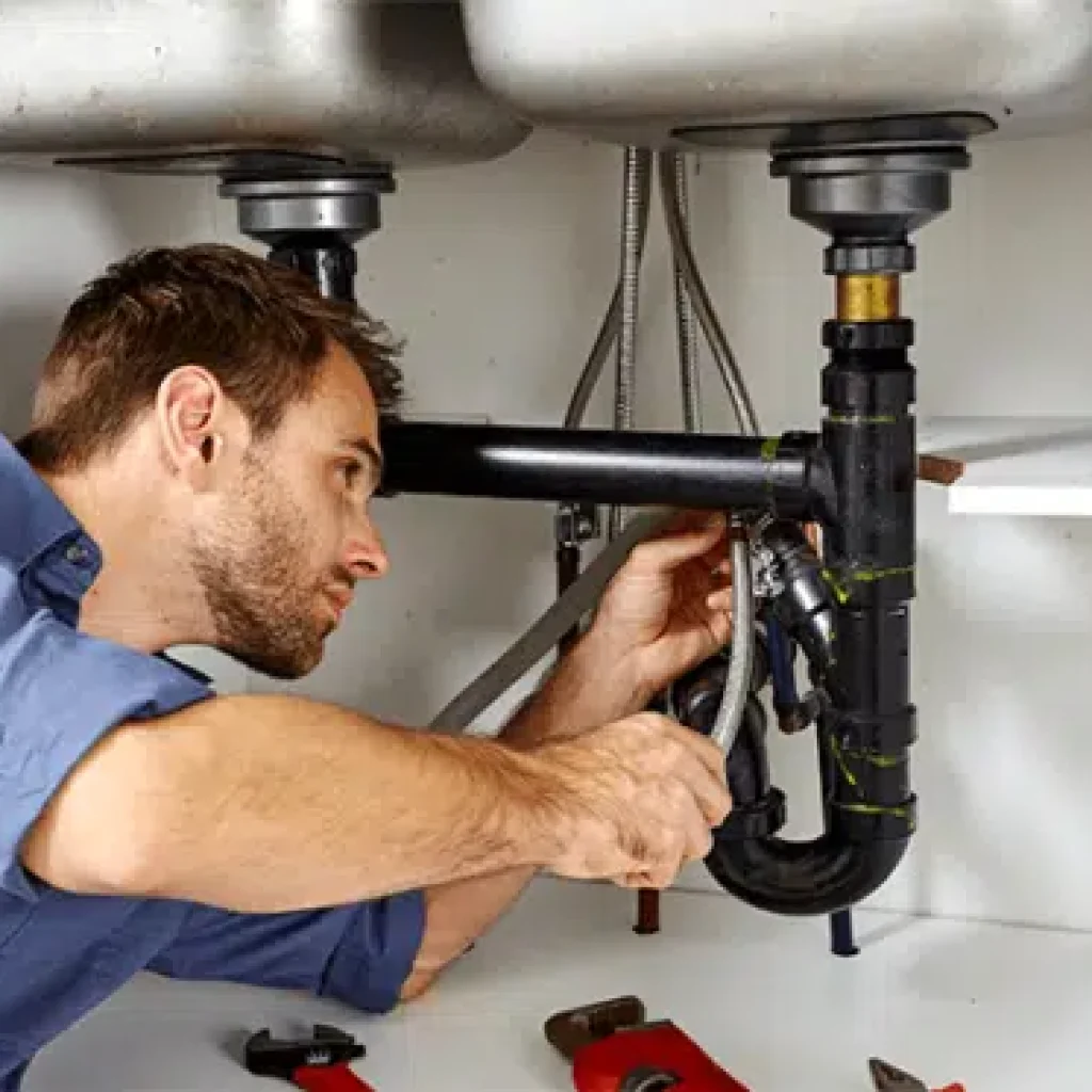 plumber repairing sink drain 497x373 2.webp